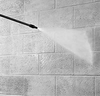 Power-washing concrete blocks